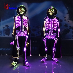 A glowing skeleton costume with a cape